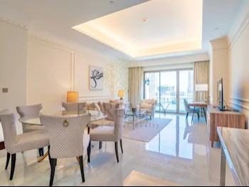 2 Bedrooms  Apartment  For Rent  in Doha -  The Pearl  Fully Furnished