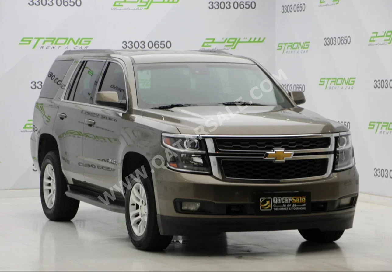  Chevrolet  Tahoe  2015  Automatic  105,000 Km  8 Cylinder  Four Wheel Drive (4WD)  SUV  Brown  With Warranty