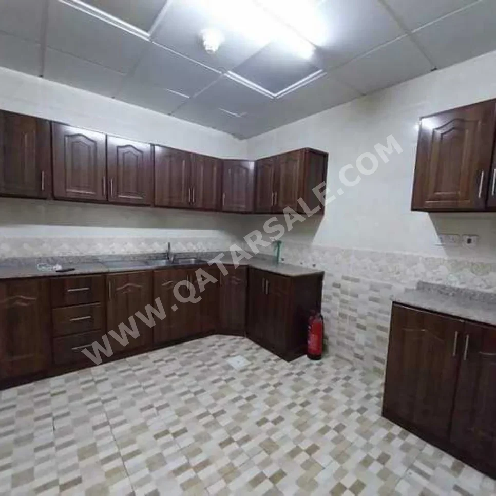 3 Bedrooms  Apartment  For Rent  in Doha -  Al Mansoura  Not Furnished