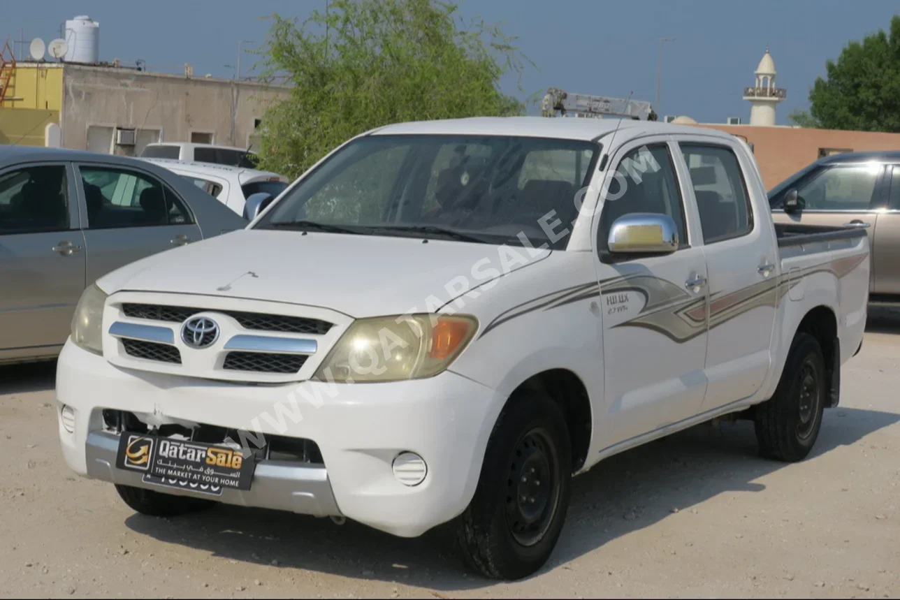 Toyota  Hilux  2006  Manual  402,000 Km  4 Cylinder  Rear Wheel Drive (RWD)  Pick Up  White