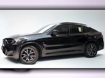 BMW  X-Series  X4  2023  Automatic  30٬700 Km  4 Cylinder  Four Wheel Drive (4WD)  SUV  Black  With Warranty