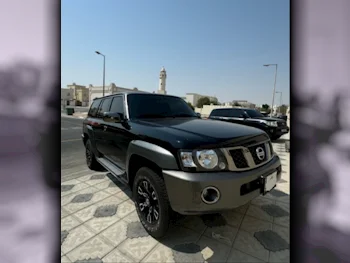 Nissan  Patrol  Super Safari  2023  Manual  48,557 Km  6 Cylinder  Four Wheel Drive (4WD)  SUV  Black and Gray  With Warranty