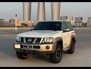 Nissan  Patrol  Super Safari  2022  Manual  22,500 Km  6 Cylinder  Four Wheel Drive (4WD)  SUV  White and Golden  With Warranty