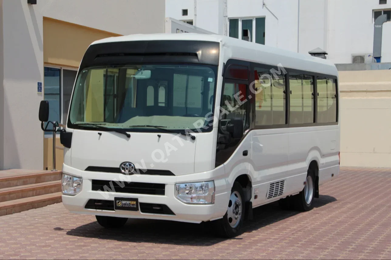 Toyota  Coaster  2017  Manual  124,000 Km  4 Cylinder  Rear Wheel Drive (RWD)  Van / Bus  White