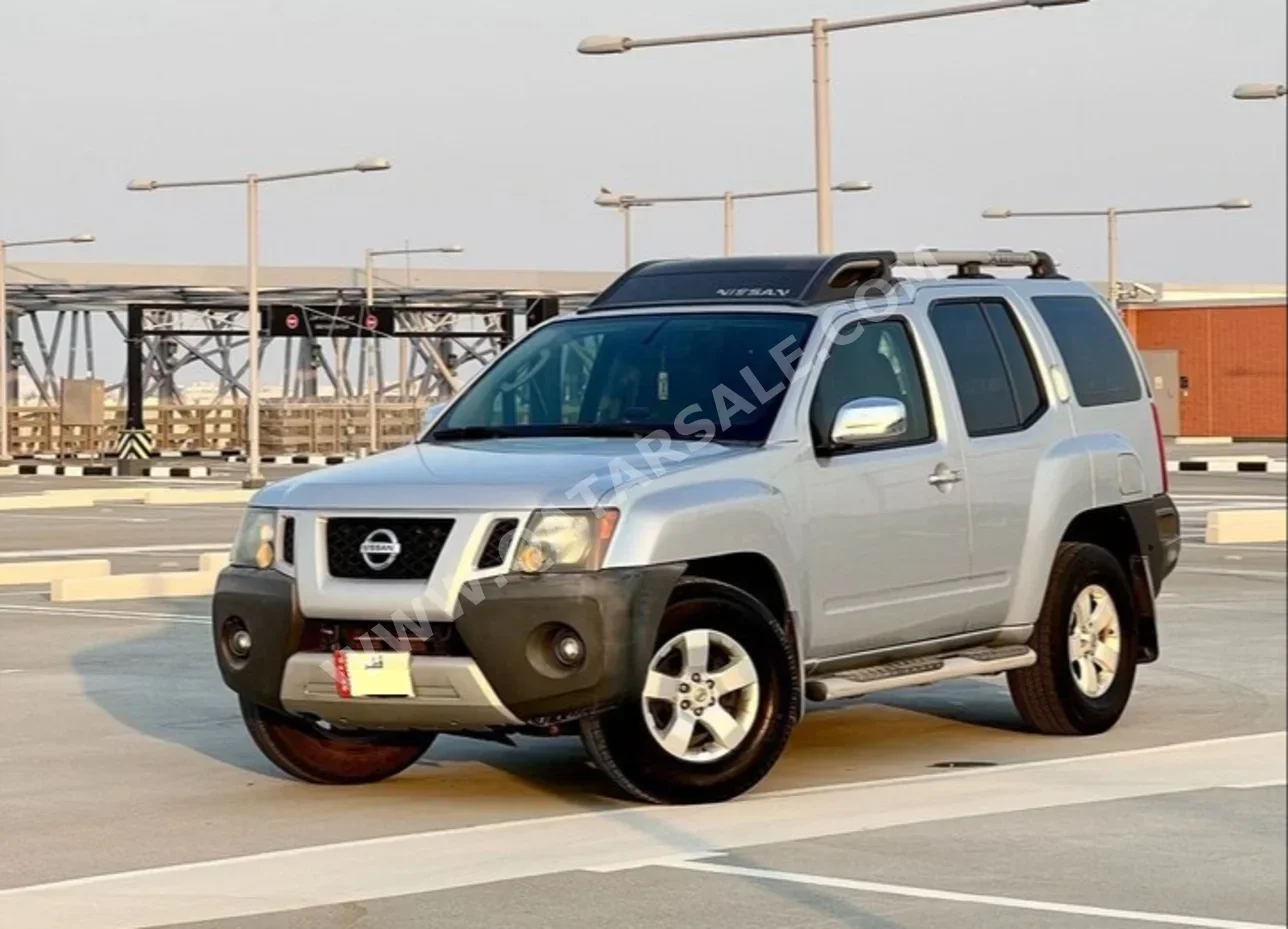 Nissan  Xterra  SE  2010  Automatic  183,000 Km  6 Cylinder  Four Wheel Drive (4WD)  SUV  Silver  With Warranty