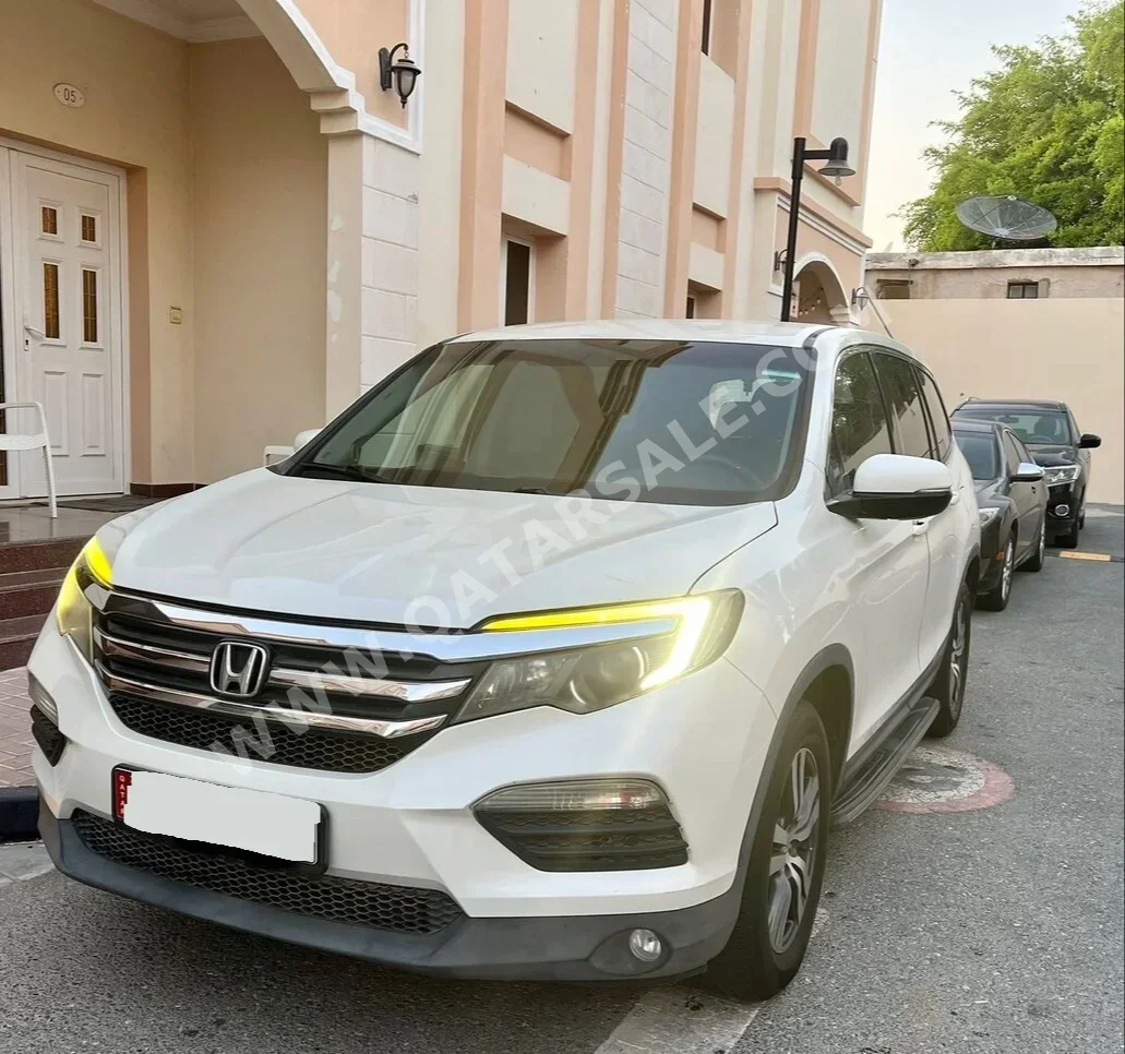 Honda  Pilot  2016  Automatic  114,000 Km  6 Cylinder  Front Wheel Drive (FWD)  SUV  White