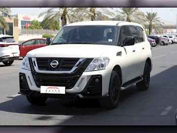 Nissan  Patrol  XE  2018  Automatic  52,000 Km  6 Cylinder  Four Wheel Drive (4WD)  SUV  White