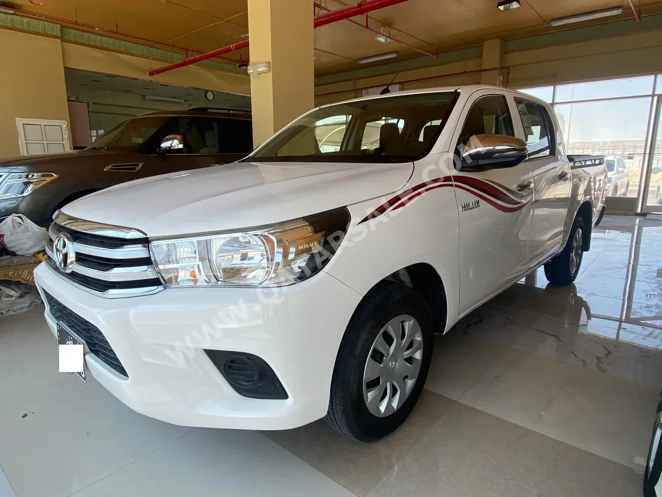 Toyota  Hilux  2021  Manual  57,000 Km  4 Cylinder  Rear Wheel Drive (RWD)  Pick Up  White