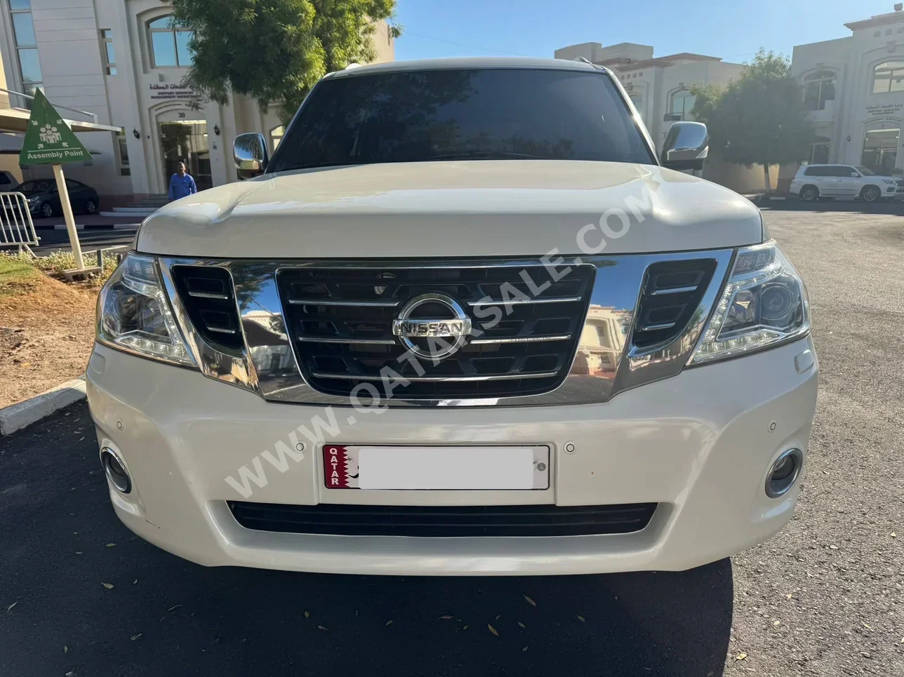 Nissan  Patrol  Platinum  2014  Automatic  180٬000 Km  8 Cylinder  Four Wheel Drive (4WD)  SUV  White