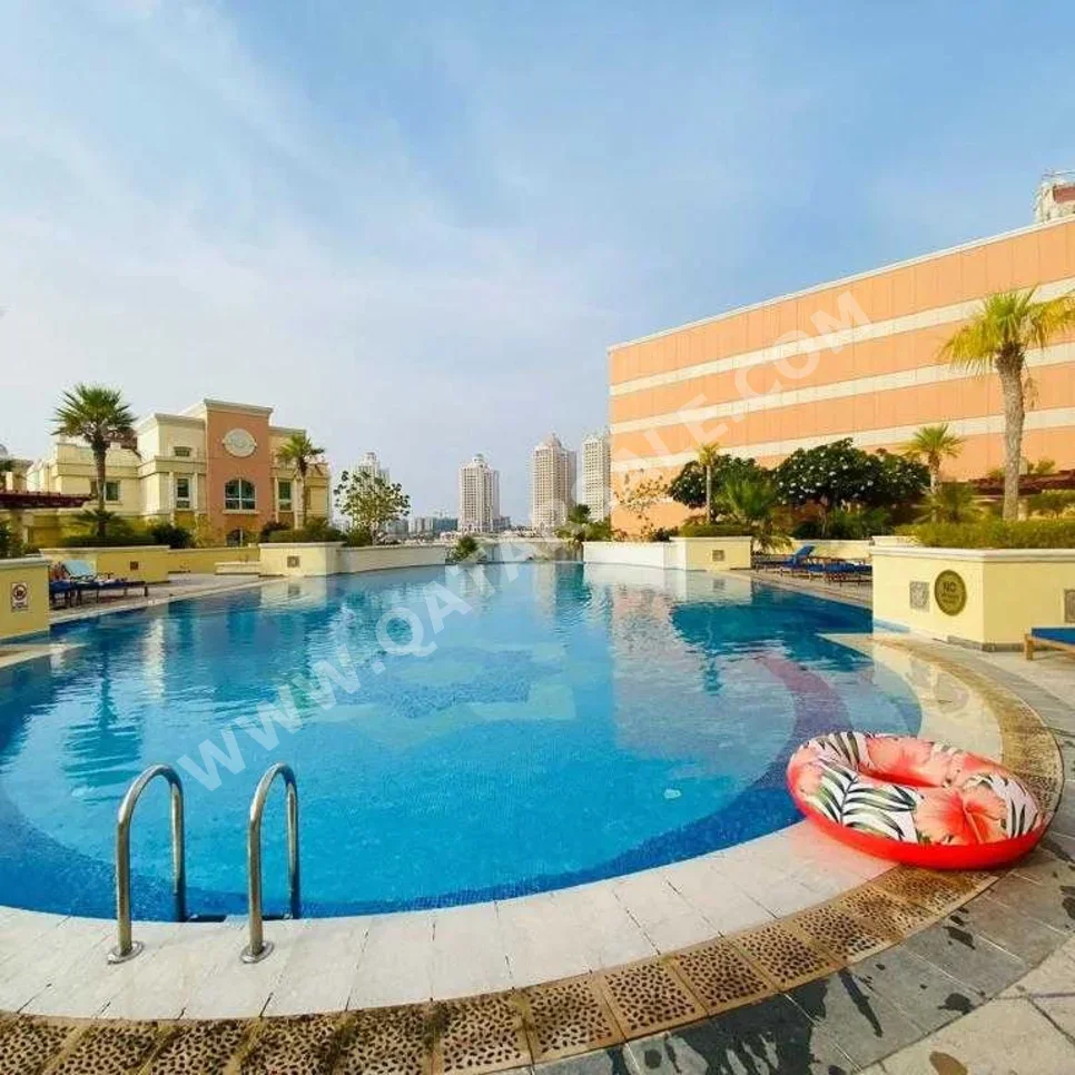 2 Bedrooms  Apartment  For Rent  in Doha -  The Pearl  Not Furnished