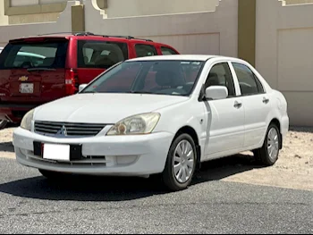 Mitsubishi  Lancer  2014  Manual  281,000 Km  4 Cylinder  Front Wheel Drive (FWD)  Sedan  White