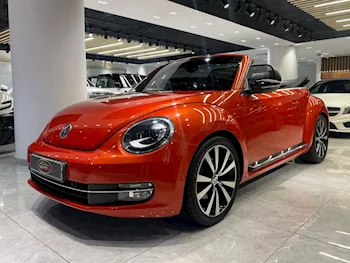 Volkswagen  Beetle  Turbo  2015  Automatic  133,000 Km  4 Cylinder  Front Wheel Drive (FWD)  Convertible  Orange