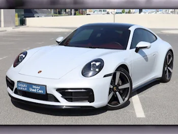 Porsche  911  Carrera  2024  Automatic  9,000 Km  6 Cylinder  Rear Wheel Drive (RWD)  Coupe / Sport  White  With Warranty