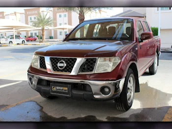 Nissan  Navara  SE  2010  Automatic  382٬000 Km  4 Cylinder  Rear Wheel Drive (RWD)  Pick Up  Maroon