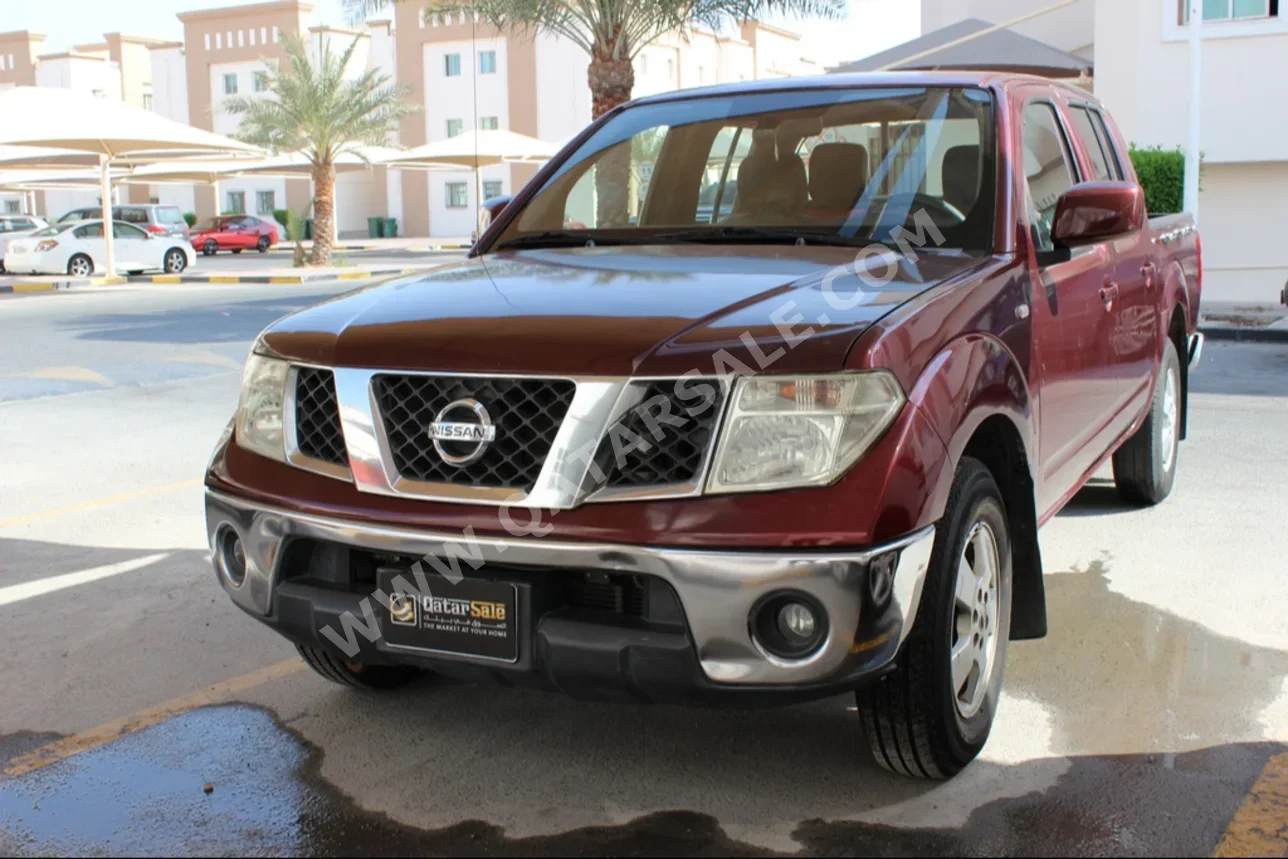 Nissan  Navara  SE  2010  Automatic  382٬000 Km  4 Cylinder  Rear Wheel Drive (RWD)  Pick Up  Maroon