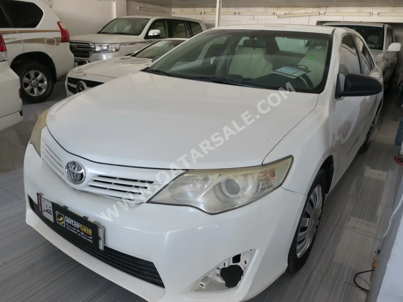 Toyota  Camry  2015  Automatic  211,000 Km  4 Cylinder  Front Wheel Drive (FWD)  Sedan  White