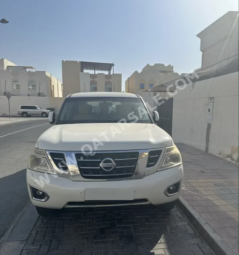 Nissan  Patrol  SE  2014  Automatic  186,000 Km  8 Cylinder  Four Wheel Drive (4WD)  SUV  White