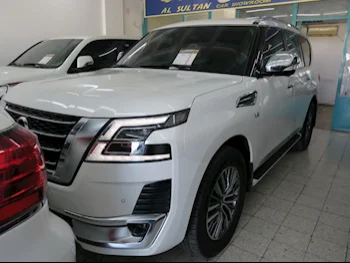 Nissan  Patrol  Platinum  2020  Automatic  24,000 Km  8 Cylinder  Four Wheel Drive (4WD)  SUV  White  With Warranty