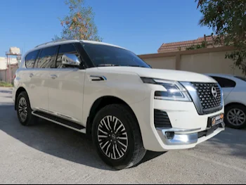 Nissan  Patrol  Platinum  2022  Automatic  51,000 Km  6 Cylinder  Four Wheel Drive (4WD)  SUV  White  With Warranty