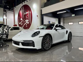  Porsche  911  Turbo  2022  Automatic  14,000 Km  6 Cylinder  Rear Wheel Drive (RWD)  Coupe / Sport  White  With Warranty