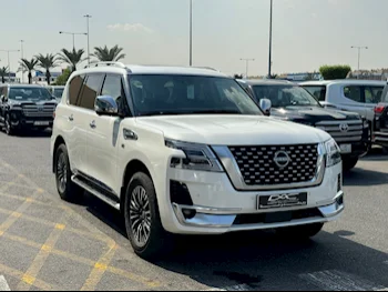 Nissan  Patrol  Platinum  2023  Automatic  44,000 Km  6 Cylinder  Four Wheel Drive (4WD)  SUV  White  With Warranty