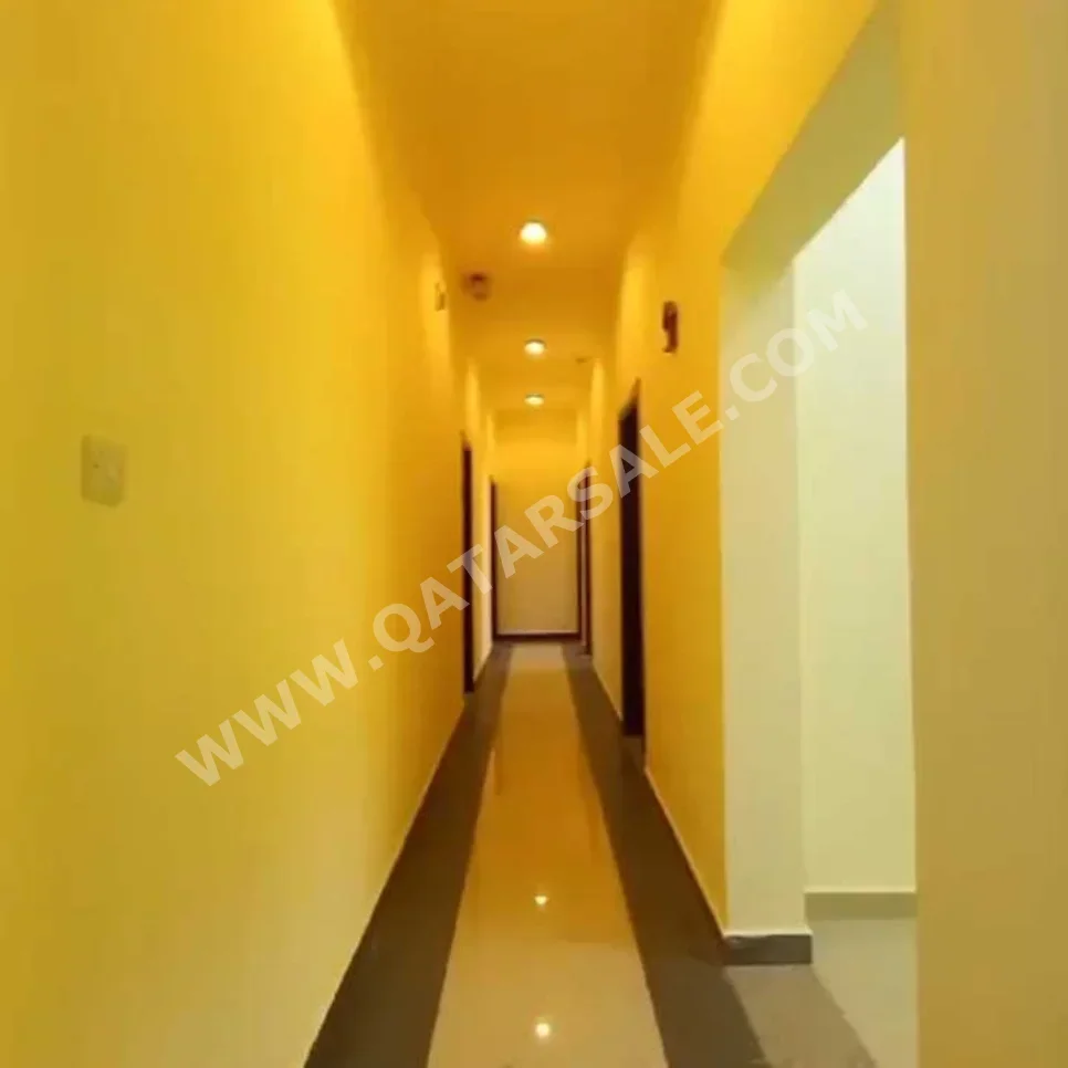 3 Bedrooms  Apartment  For Rent  in Doha -  Al Mansoura  Not Furnished