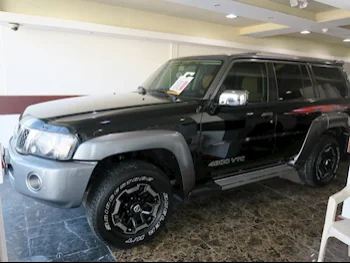 Nissan  Patrol  Super Safari  2022  Automatic  27,000 Km  6 Cylinder  Four Wheel Drive (4WD)  SUV  Black  With Warranty