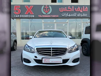 Mercedes-Benz  E-Class  200  2014  Automatic  186,000 Km  4 Cylinder  Rear Wheel Drive (RWD)  Sedan  White