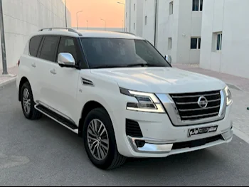 Nissan  Patrol  Platinum  2021  Automatic  97٬000 Km  8 Cylinder  Four Wheel Drive (4WD)  SUV  White  With Warranty