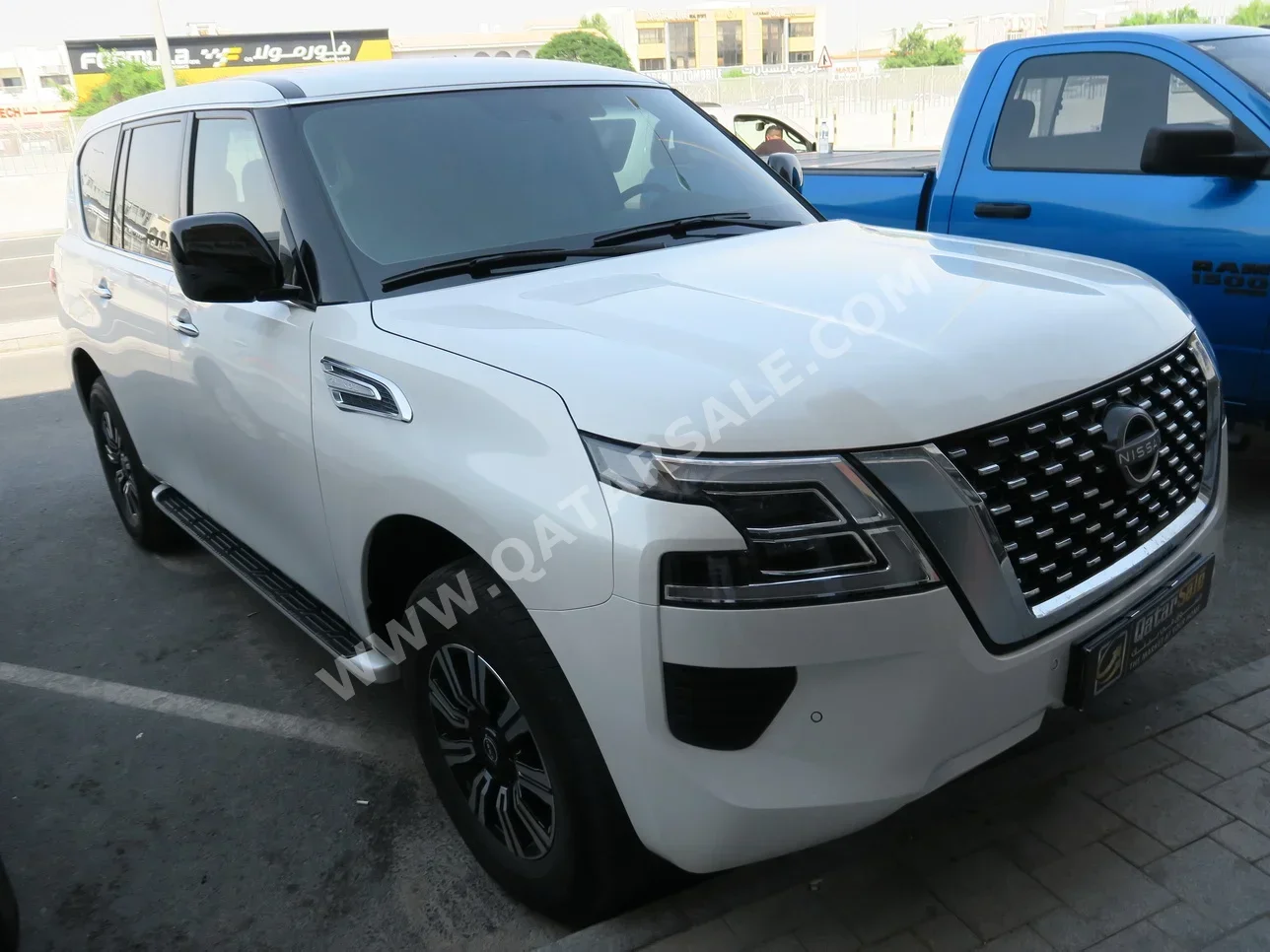 Nissan  Patrol  XE  2023  Automatic  34,000 Km  6 Cylinder  Four Wheel Drive (4WD)  SUV  White  With Warranty