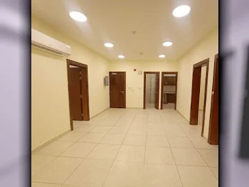 3 Bedrooms  Apartment  For Rent  in Doha -  Al Mansoura  Not Furnished