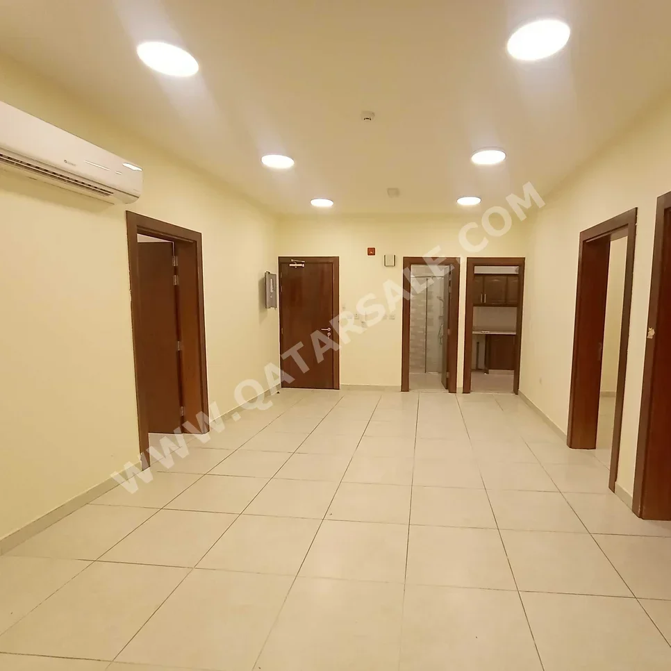 3 Bedrooms  Apartment  For Rent  in Doha -  Al Mansoura  Not Furnished