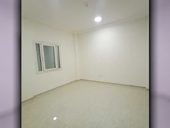 2 Bedrooms  Apartment  For Rent  in Doha -  Al Mansoura  Not Furnished