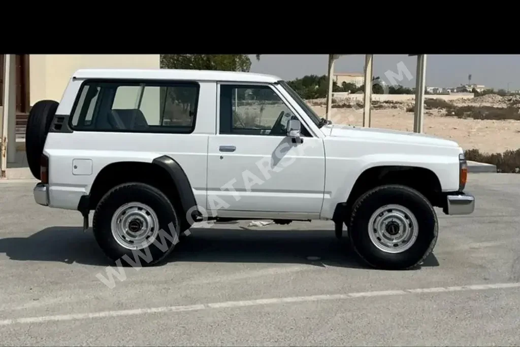  Nissan  Patrol  Safari  1991  Manual  250,000 Km  6 Cylinder  Four Wheel Drive (4WD)  SUV  White  With Warranty