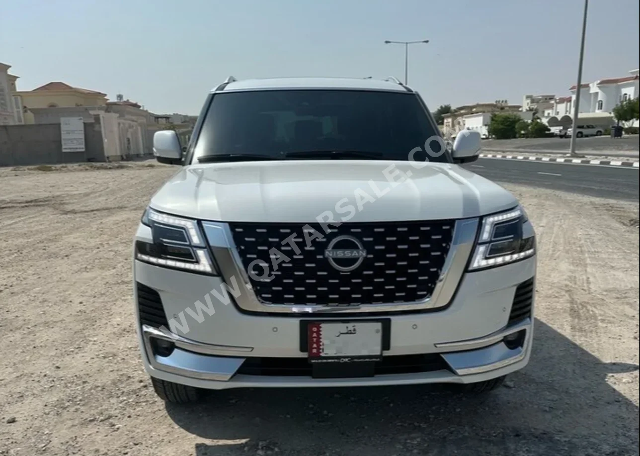 Nissan  Patrol  SE Titanium  2024  Automatic  7,000 Km  6 Cylinder  Four Wheel Drive (4WD)  SUV  White  With Warranty
