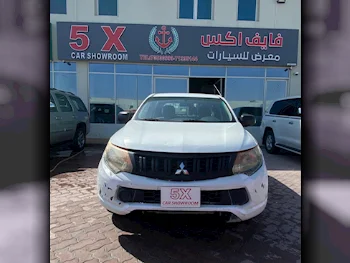 Mitsubishi  L 200  2017  Manual  290,000 Km  4 Cylinder  Rear Wheel Drive (RWD)  Pick Up  White