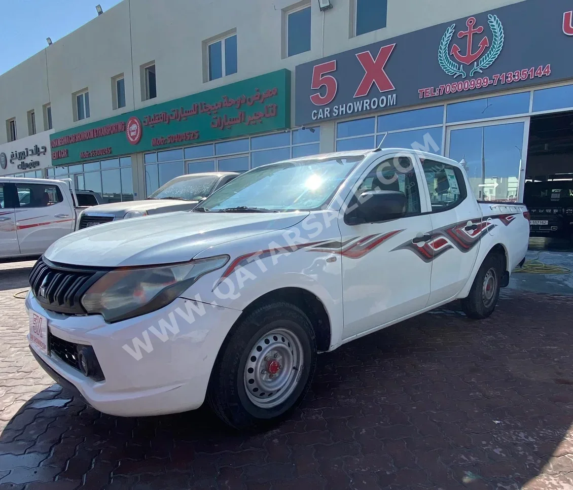 Mitsubishi  L 200  2017  Manual  525,000 Km  4 Cylinder  Rear Wheel Drive (RWD)  Pick Up  White