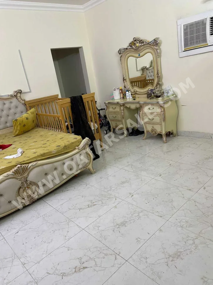 2 Bedrooms  Apartment  For Rent  in Doha -  Al Dafna  Not Furnished