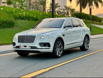 Bentley  Bentayga  Mulliner  2019  Automatic  110٬000 Km  12 Cylinder  All Wheel Drive (AWD)  SUV  White