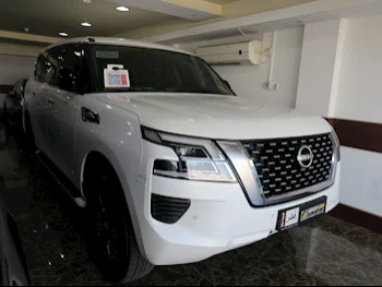 Nissan  Patrol  XE  2022  Automatic  12,000 Km  6 Cylinder  Four Wheel Drive (4WD)  SUV  White  With Warranty