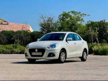 Suzuki  Dzire  2022  Automatic  69,500 Km  4 Cylinder  Front Wheel Drive (FWD)  Sedan  White