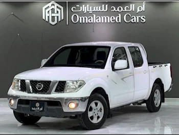 Nissan  Navara  2010  Manual  256,000 Km  4 Cylinder  Rear Wheel Drive (RWD)  Pick Up  White