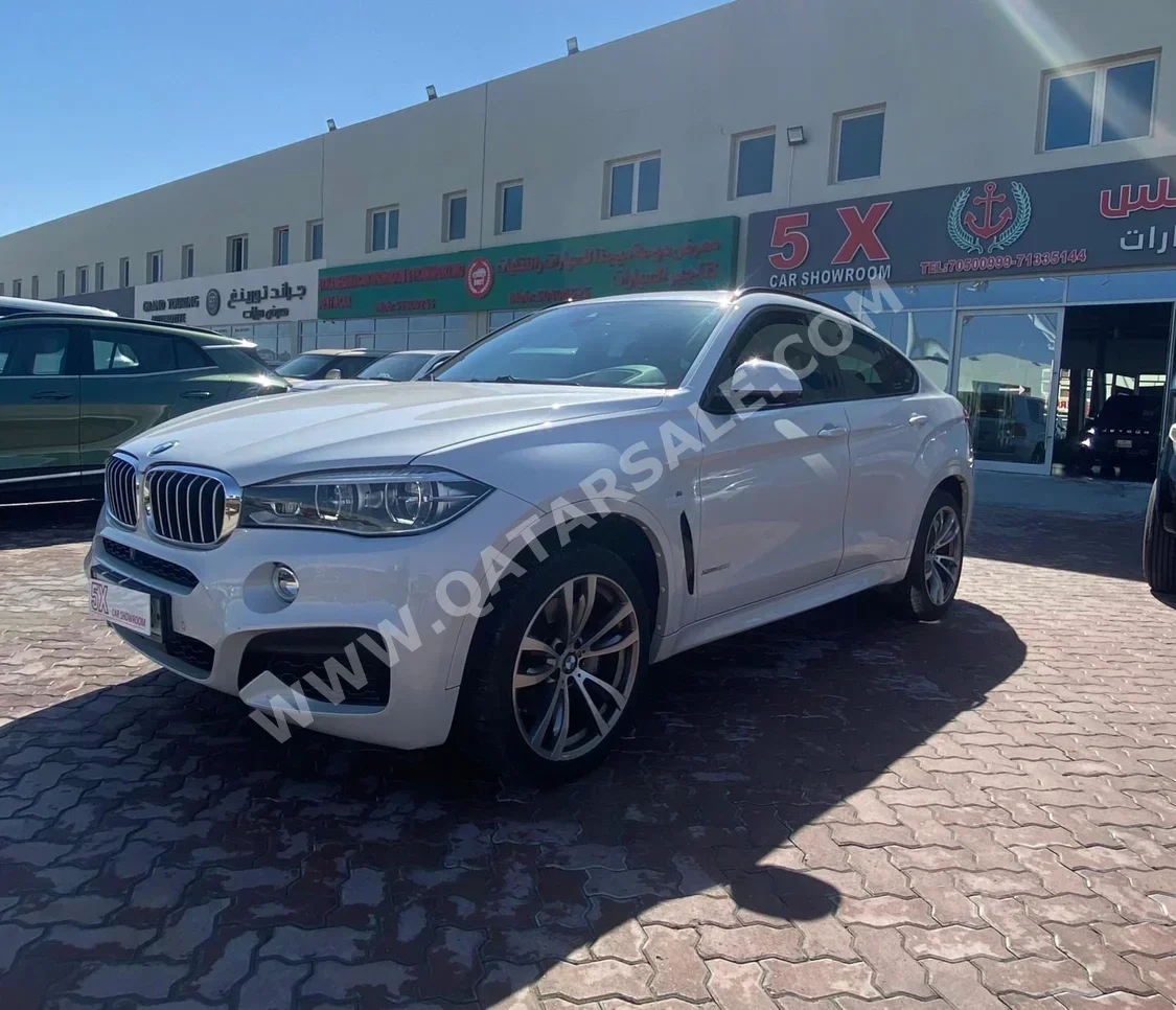 BMW  X-Series  X6 M50i  2016  Automatic  113,000 Km  8 Cylinder  Four Wheel Drive (4WD)  SUV  White