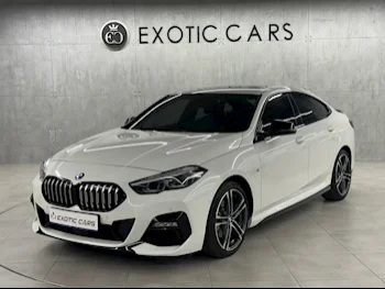 BMW  2-Series  218i  2021  Automatic  65,000 Km  4 Cylinder  Rear Wheel Drive (RWD)  Sedan  White  With Warranty