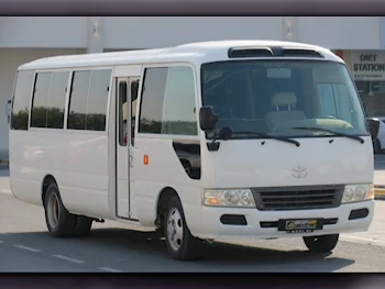 Toyota  Coaster  2014  Manual  182,000 Km  4 Cylinder  Rear Wheel Drive (RWD)  Van / Bus  White