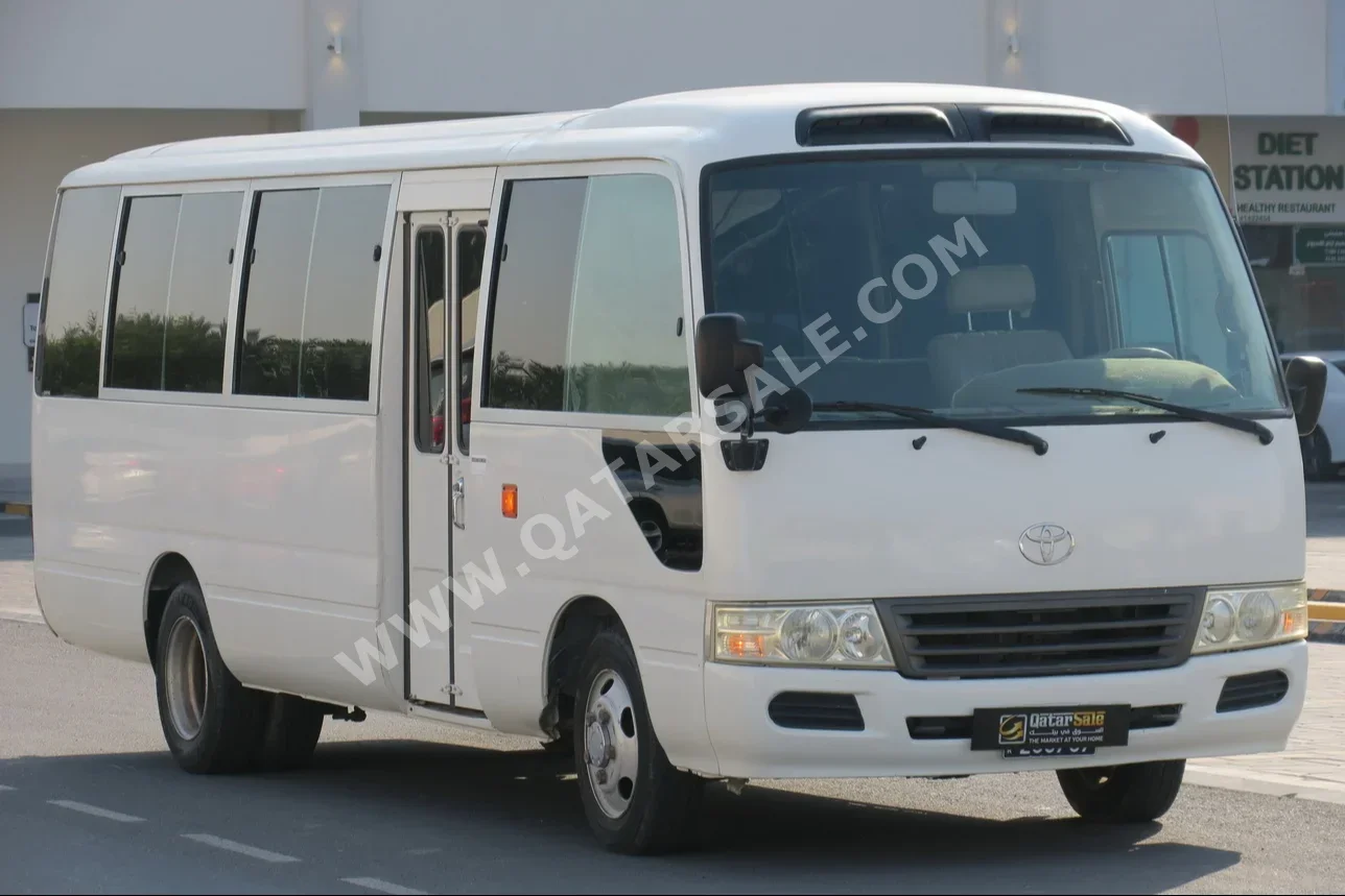 Toyota  Coaster  2014  Manual  182,000 Km  4 Cylinder  Rear Wheel Drive (RWD)  Van / Bus  White