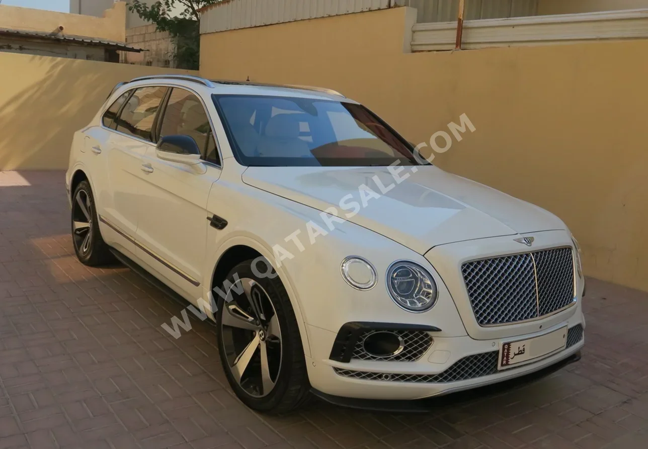 Bentley  Bentayga  2017  Automatic  62,000 Km  12 Cylinder  Four Wheel Drive (4WD)  SUV  White