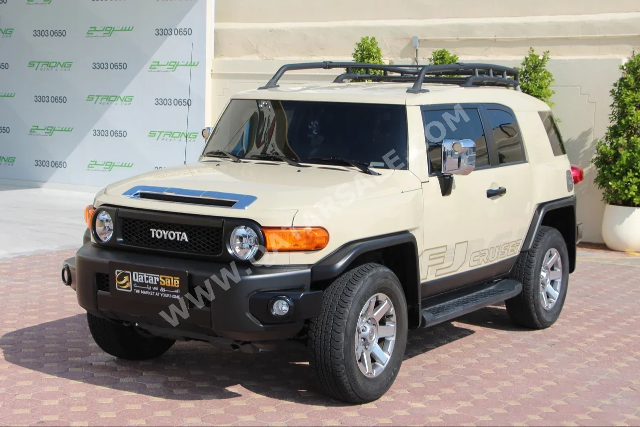 Toyota  FJ Cruiser  2023  Automatic  14,000 Km  6 Cylinder  Four Wheel Drive (4WD)  SUV  Beige  With Warranty