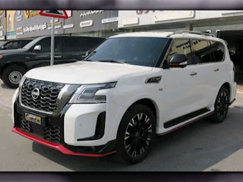  Nissan  Patrol  Nismo  2022  Automatic  128,000 Km  8 Cylinder  Four Wheel Drive (4WD)  SUV  White  With Warranty