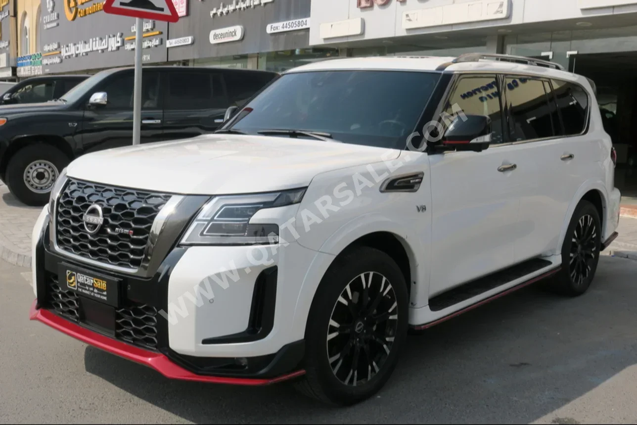  Nissan  Patrol  Nismo  2022  Automatic  128,000 Km  8 Cylinder  Four Wheel Drive (4WD)  SUV  White  With Warranty